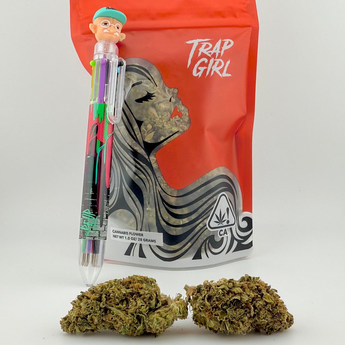 *Deal! $79 1 oz. Pablo Revenge (24.03%/Indica) - Trap Girl + Multi-Colored Writing Pen