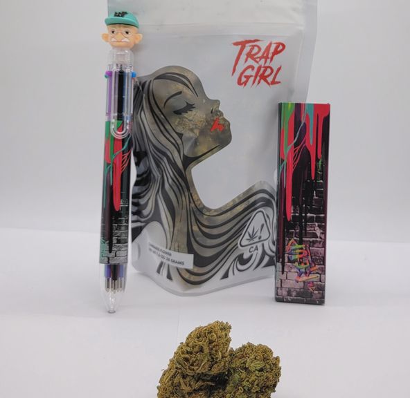 *Deal! $99 1 oz. Tropicana Cookies (28.96%/Sativa) - Trap Girl + Rolling Papers + Multi-Color Pen